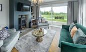 Bellshill Bothy - sitting room with comfortable seating, wood burning stove, and Smart TV