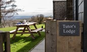 Tutor's Lodge - slate signage and picnic table within the rear garden