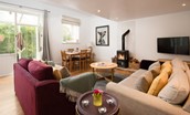 Priory Cottage - wood burning stove and Smart TV in the bright open plan sitting room