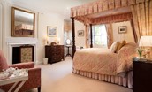 The Tower, Keith Marischal - bedroom two with king size four-poster canopy bed, beautiful antique furniture and decorative fireplace