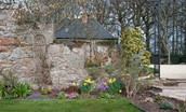 Hiddenhus - colourful border within the pretty walled garden