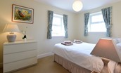 Hawthorn House -  bedroom three with double bedroom and chest of drawers for storage