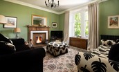 Mossfennan House - cosy fire, TV and two sofas in the ground floor snug