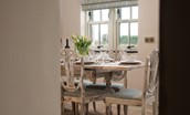 Goose Cottage - entranceway into open-plan kitchen and dining area, seating six around the chic wooden dining set