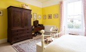 The Old Manse - bedroom two with antique wardrobe and dressing table