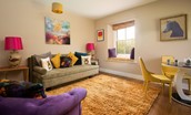 Walltown Farm Cottage - first floor lounge with three-seater sofa that can be used as a sofa bed upon request