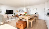 6 The Bay, Coldingham - modern pendant lighting is mounted above the chunky dining table and benches