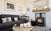 The Fairway - relax in front of the log burner after a busy day exploring the coast
