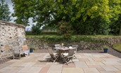 Lilylaw - enjoy outside dining with bench seating and table seating four guests