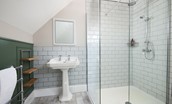 Sandsend - family bathroom containing large walk-in shower with rainforest head and separate shower head attachment
