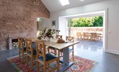 Papple Steading - Grieve's Cottage - dining space with patio doors leading to outdoor dining space
