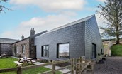 Tutor's Lodge - a modern extension with a smart slate finish adjoins the traditional stone cottage