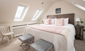 Mill Cottage, Brockmill Farm - bedroom one with zip and link beds, bedside tables, storage and stool seating