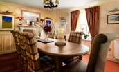 Dryburgh Farmhouse - separate dining room with dining table which seats six but can extend to seat 8