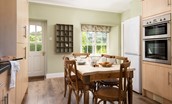 Laurel Cottage - bright dining space with access door to the rear