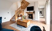 Mill Cottage, Brockmill Farm - Smart TV and log burner in the sitting room with staircase leading to the upper floor