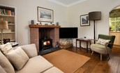 Pentland Cottage - the cosy sitting room with wood-burning stove