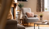 Swan's Nest - pretty cottage detailing with a fireside armchair