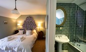 The Boathouse - bedroom four with king size bed and en suite bathroom