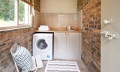 Park End - outdoor utility toom with sink and washer/dryer