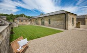 Beeswing House - the stunning exterior view of the house with lawned garden