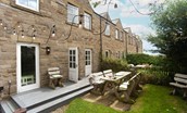 Nook End - outdoor dining table with festoon lighting for ambient alfresco dining