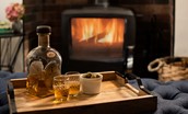 Peewit Cottage - enjoy a drink in front of the cosy wood burner