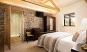 The Old Byre at West Moneylaws - exposed stone work and wooden trusses add character to all of the rooms