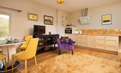 Walltown Farm Cottage - first floor lounge with kitchenette area, Smart TV, and round dining table with 4 chairs
